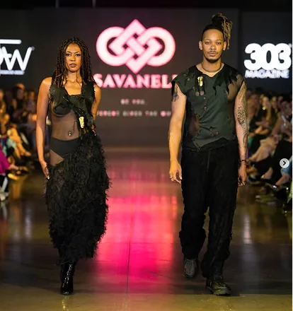 Two models walking the Savaneli runway in black couture